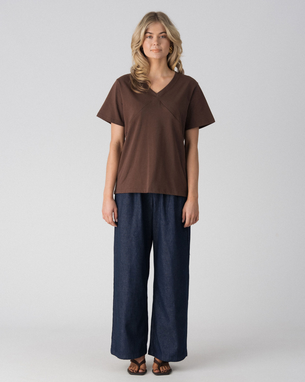 Lenelly Avery V-neck nursing tee in brown, an oversized breastfeeding-friendly tee styled with wide leg jeans, front view