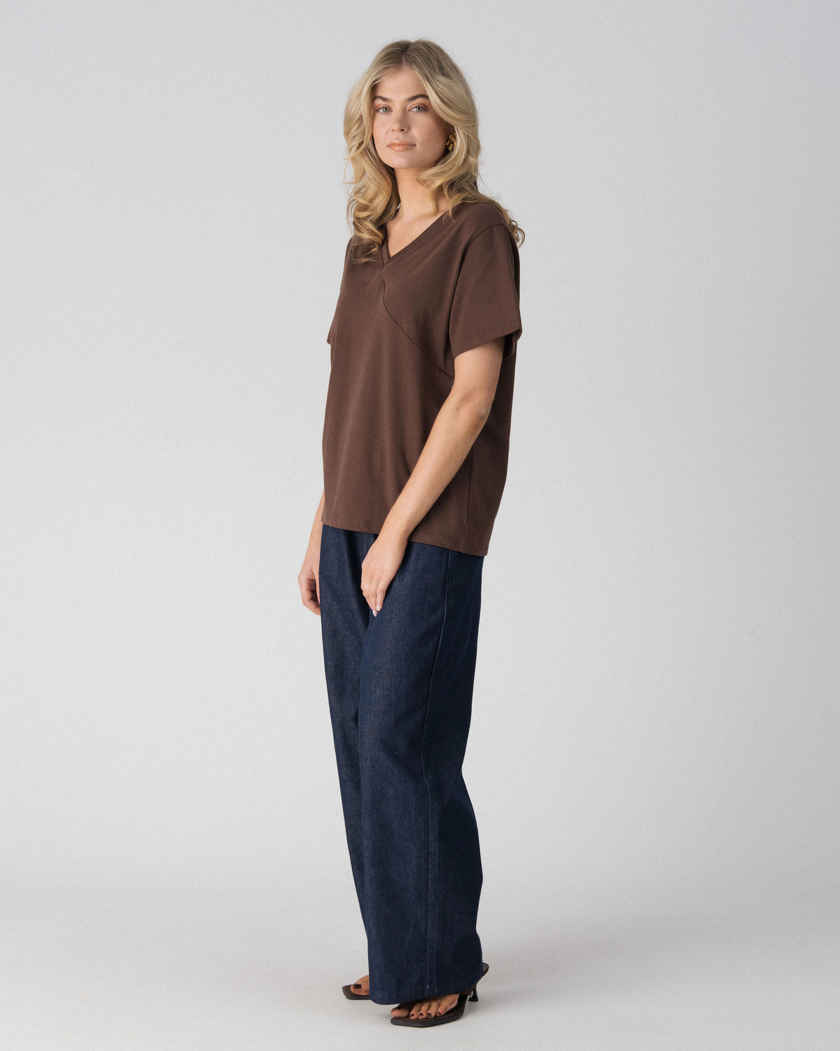 Lenelly Avery V-neck tee in brown, angled view showing the relaxed oversized fit