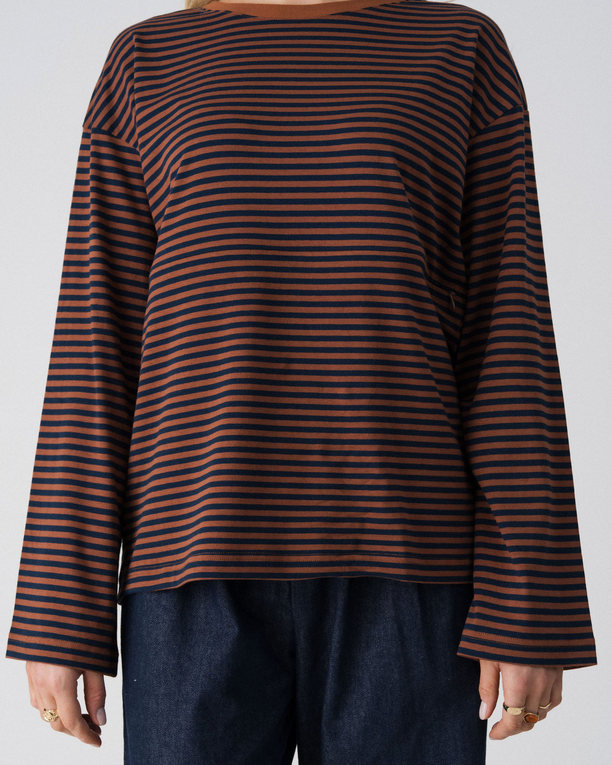 Close-up of the Lenelly Lena nursing tee in brown and navy stripe, showing the wide sleeve and contrast brown neckline