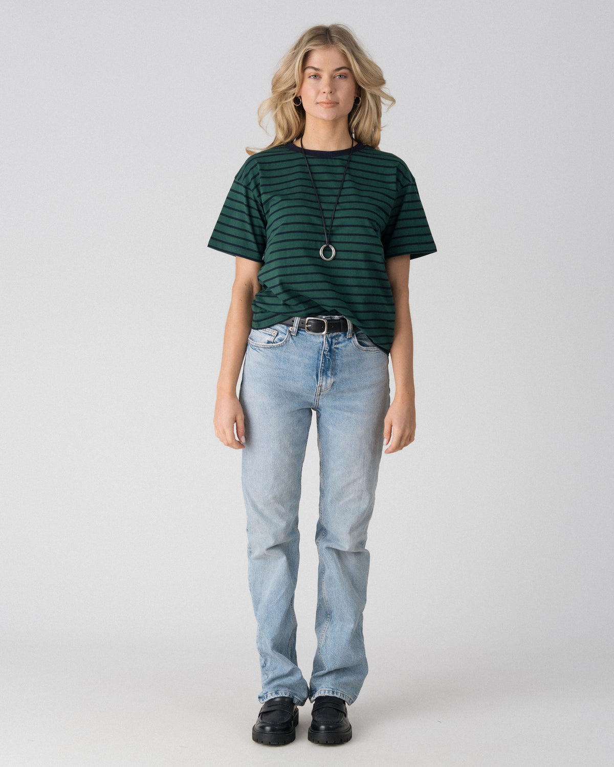 Lenelly Issa everyday striped nursing tee in forest green and navy, a breastfeeding-friendly tee styled with light wash jeans, front view