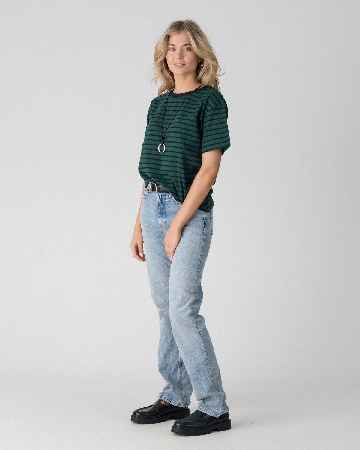 Lenelly Issa striped tee in forest green and navy, angled view showing the relaxed everyday fit