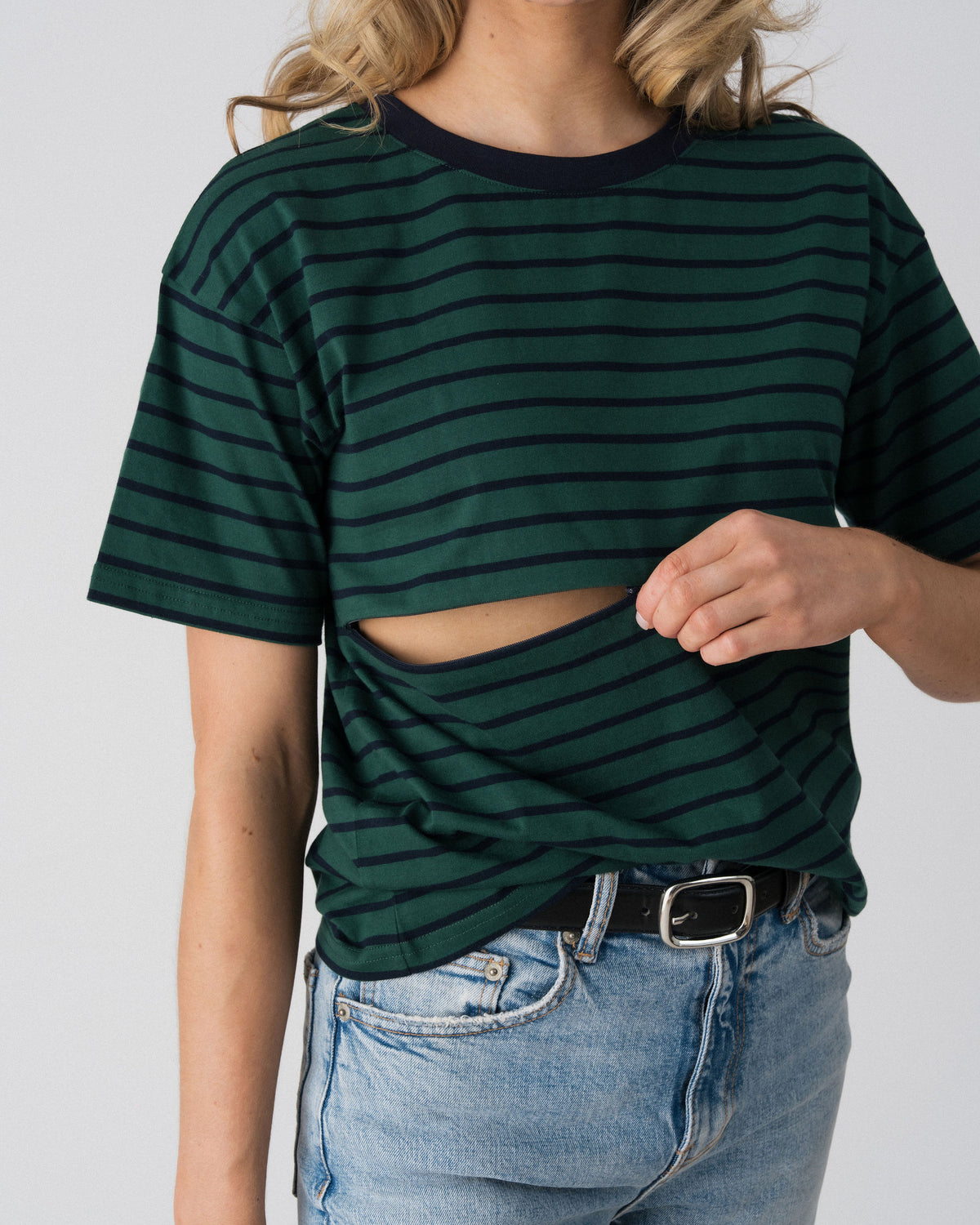 Lenelly Issa nursing tee in forest green and navy with the two-way underbust zip opened, showing how the breastfeeding access works