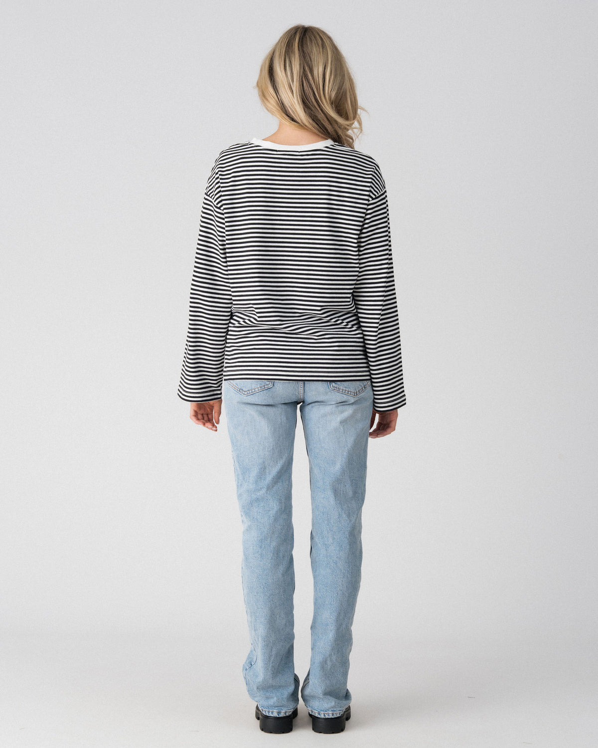 Back view of the Lenelly Lena oversized long sleeve striped tee in black and white