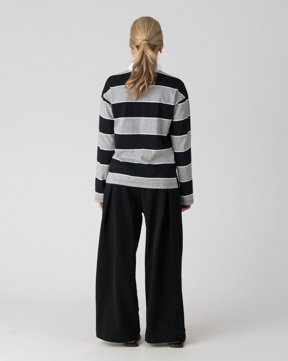 Back view of the Lenelly Erika rugby nursing polo in black and grey stripe