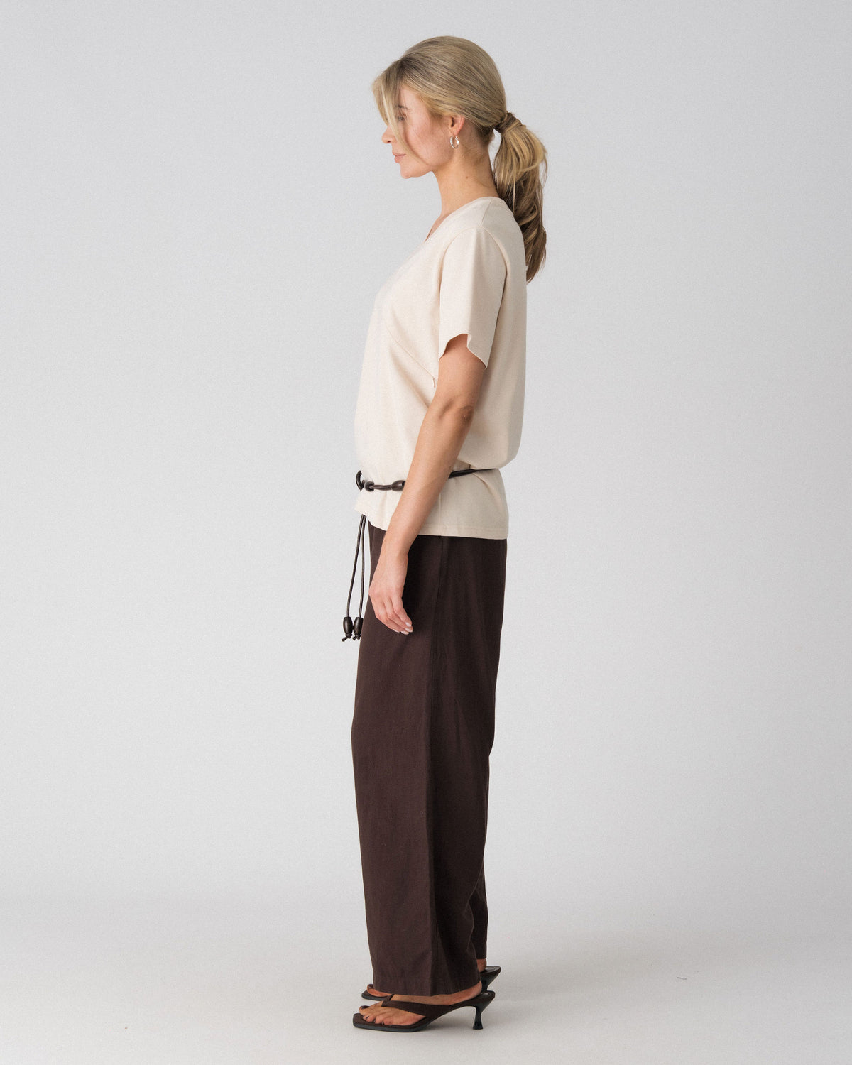 Lenelly Avery V-neck tee in sand, side view showing the relaxed oversized fit