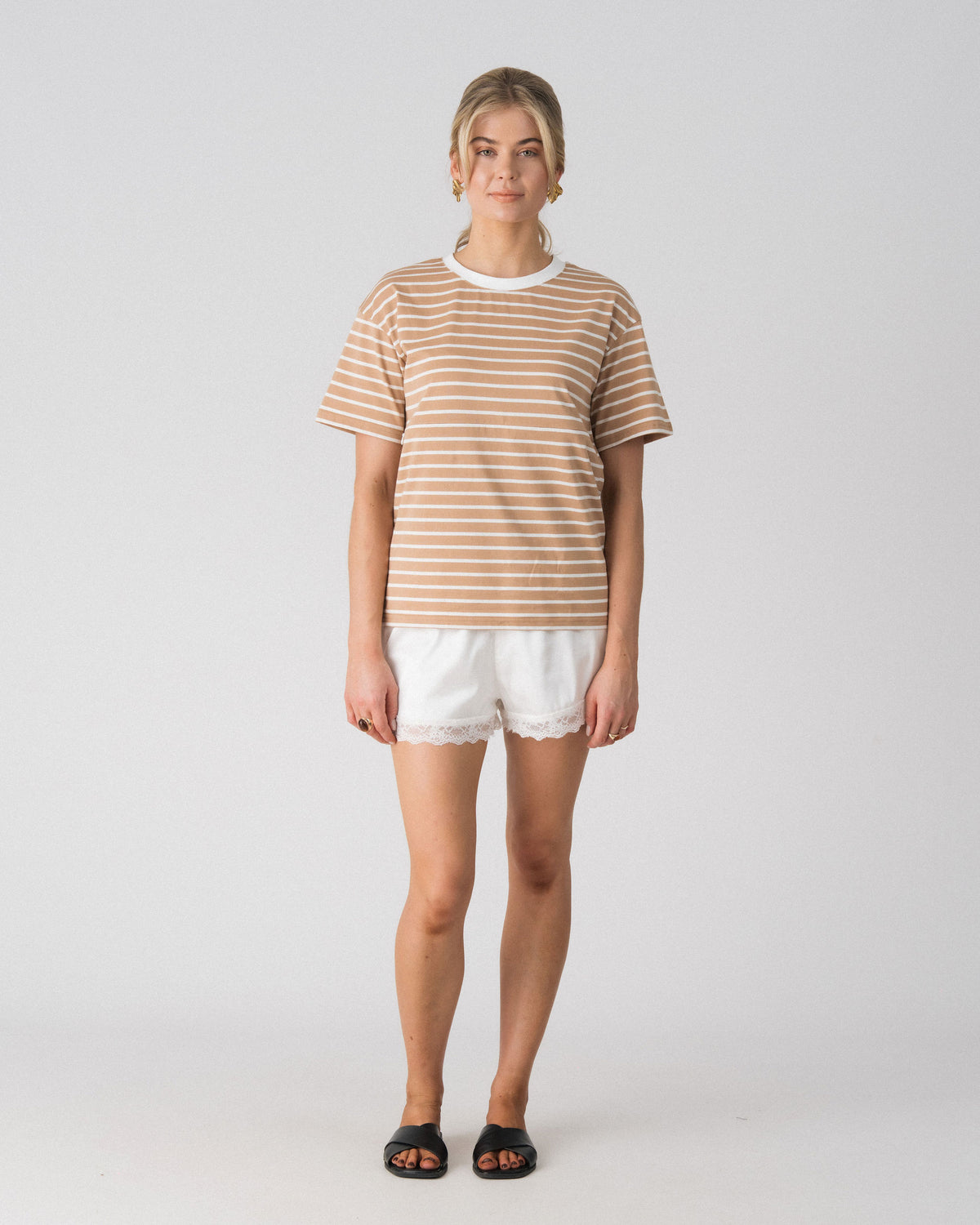 Lenelly Issa everyday striped nursing tee in tan and white, a breastfeeding-friendly tee styled with white lace trim shorts, front view