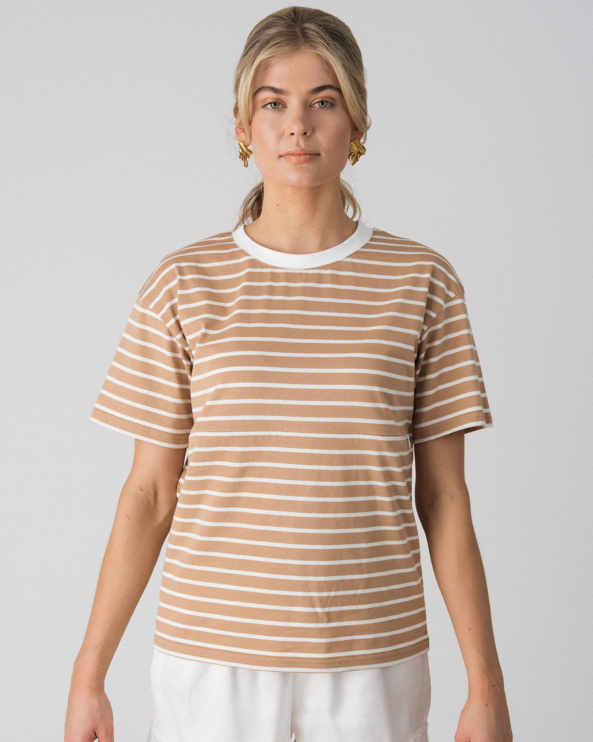 Close-up of the Lenelly Issa nursing tee in tan and white stripe, showing the hidden underbust zip concealed within the stripe