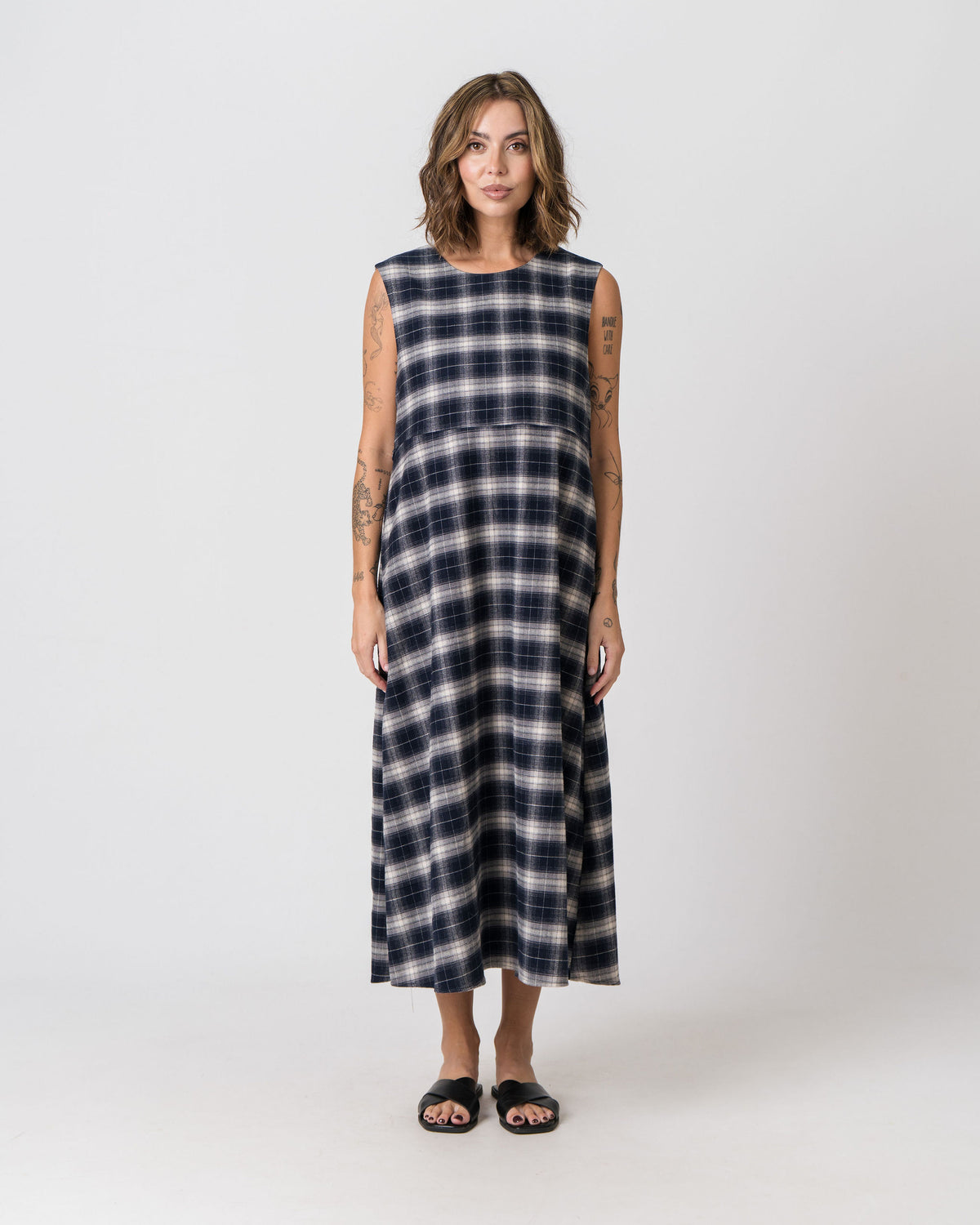 Lenelly Bridget reversible flannel dress in navy and cream plaid, a sleeveless breastfeeding-friendly midi dress, front view on a white background