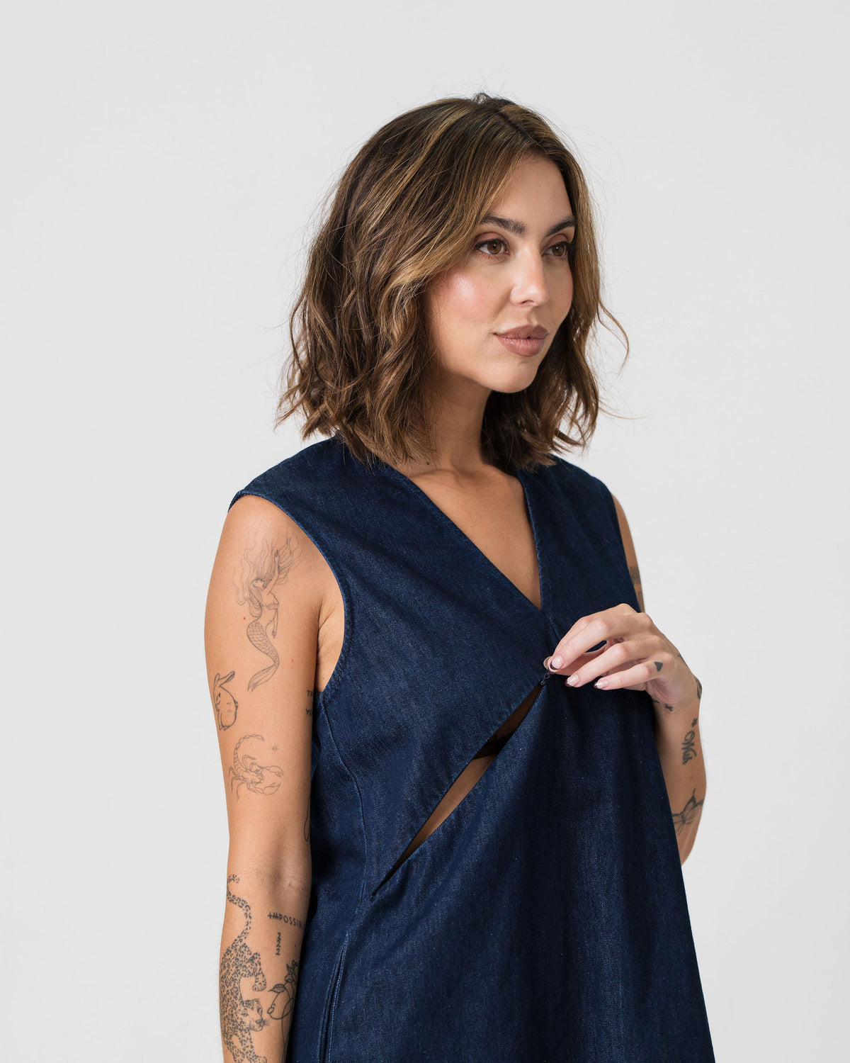 Close-up of the hidden nursing zip on the Lenelly Frankie denim dress, shown open for feeding access