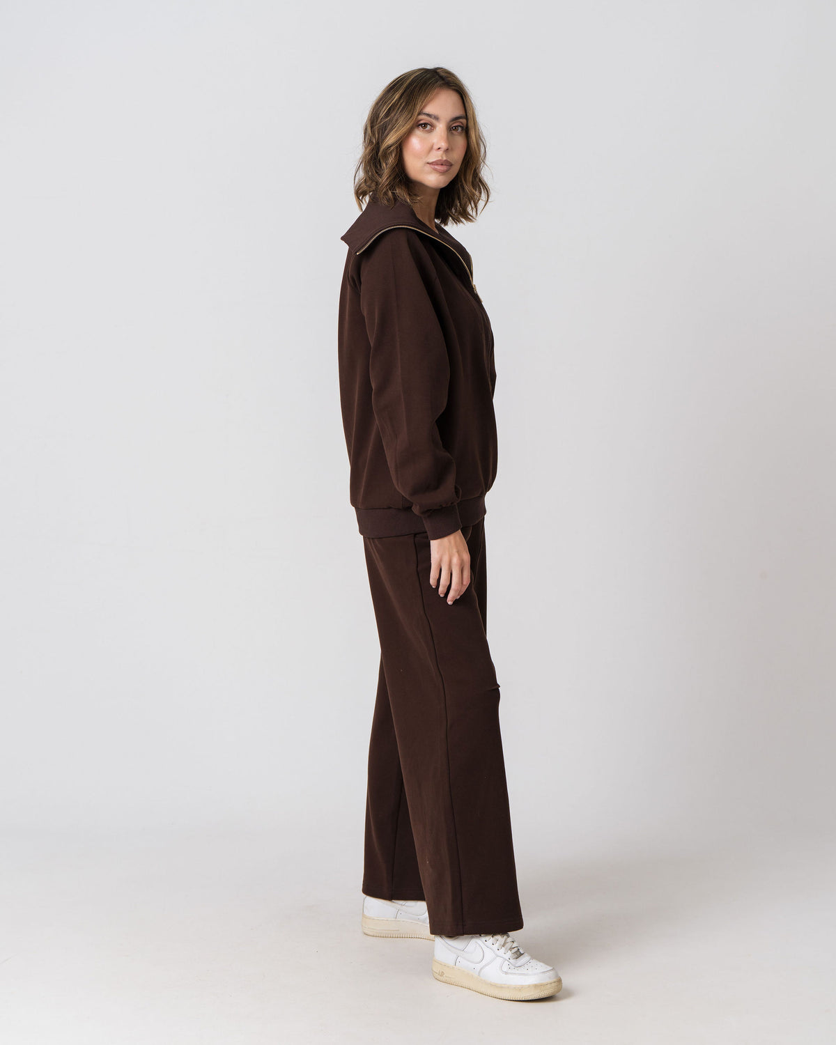 Lenelly Mish half zip nursing sweatshirt and matching sweatpants in chocolate, side view on a light studio background