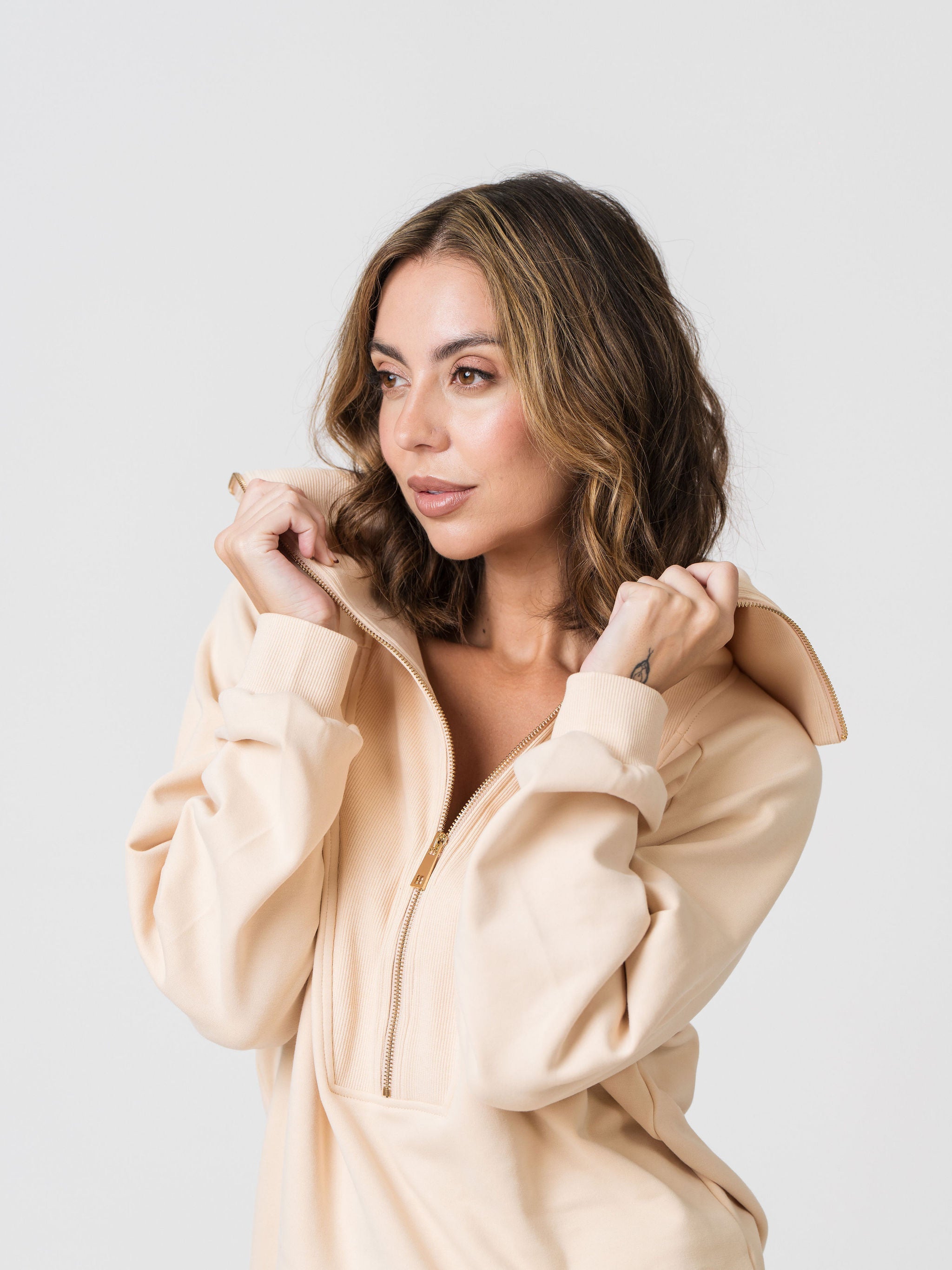 Woman wearing Lenelly cotton sweatshirt and sweatpants set designed for motherhood and everyday comfort.