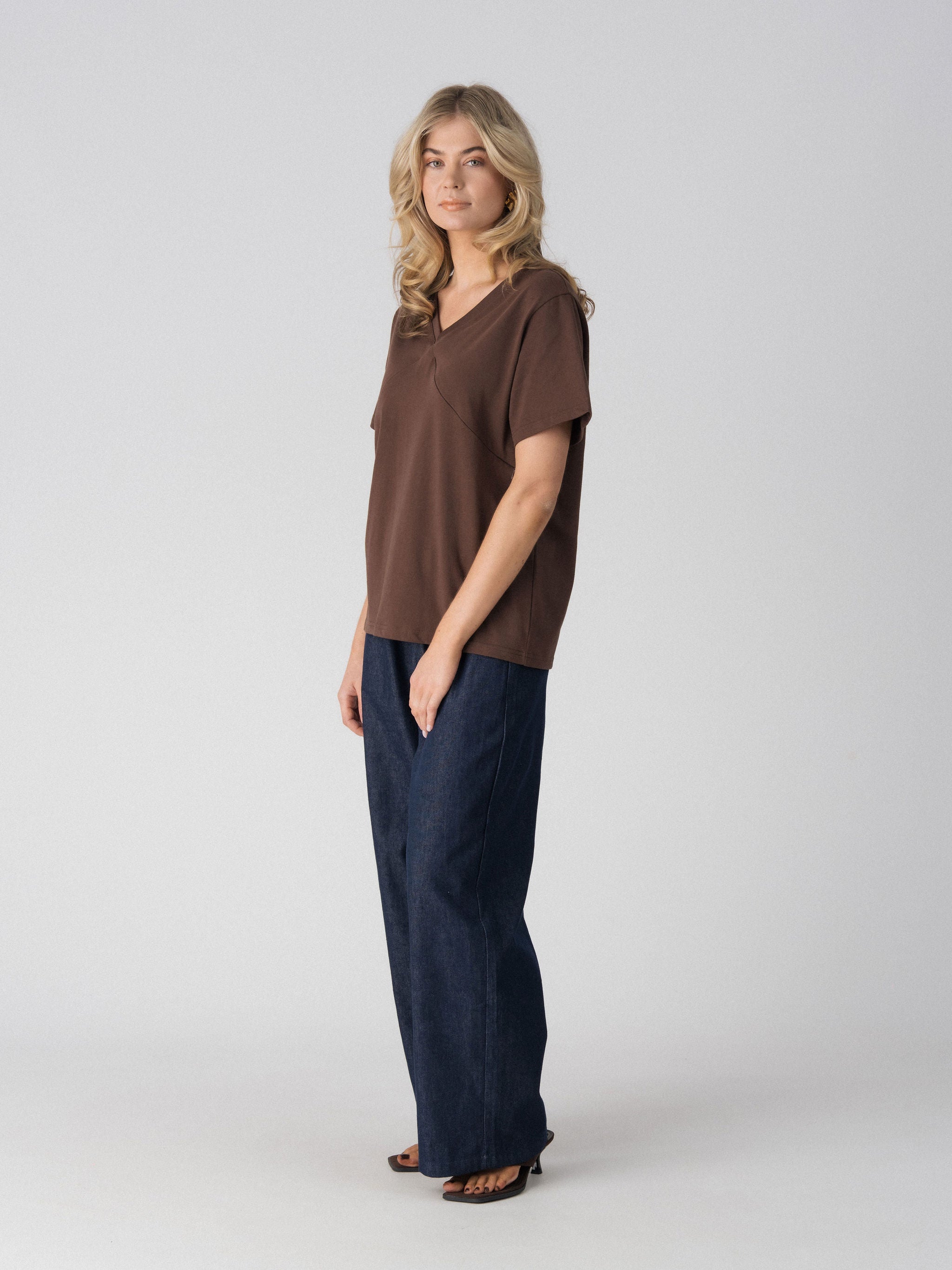 Lenelly Avery V-neck tee in brown, angled view showing the relaxed oversized fit