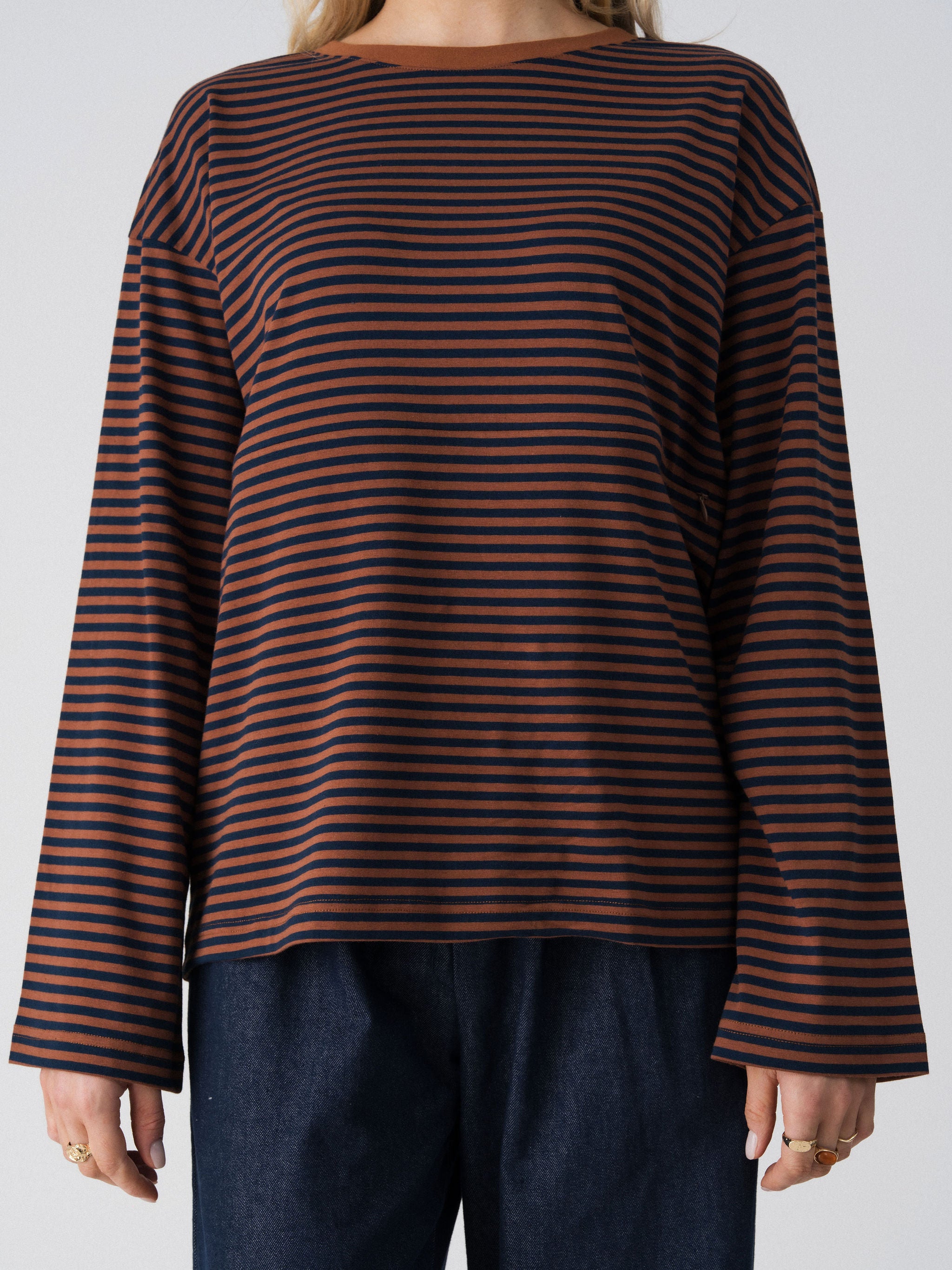 Close-up of the Lenelly Lena nursing tee in brown and navy stripe, showing the wide sleeve and contrast brown neckline