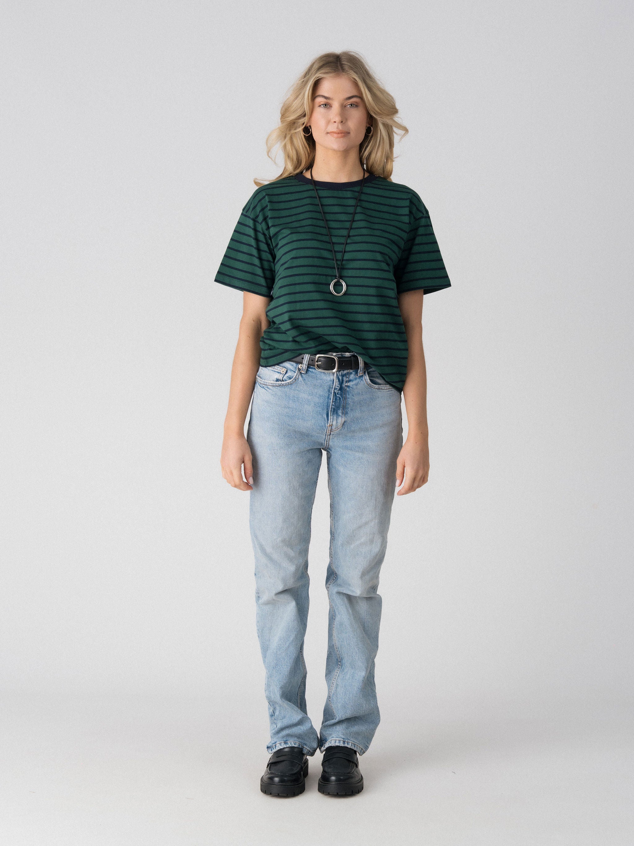 Lenelly Issa everyday striped nursing tee in forest green and navy, a breastfeeding-friendly tee styled with light wash jeans, front view