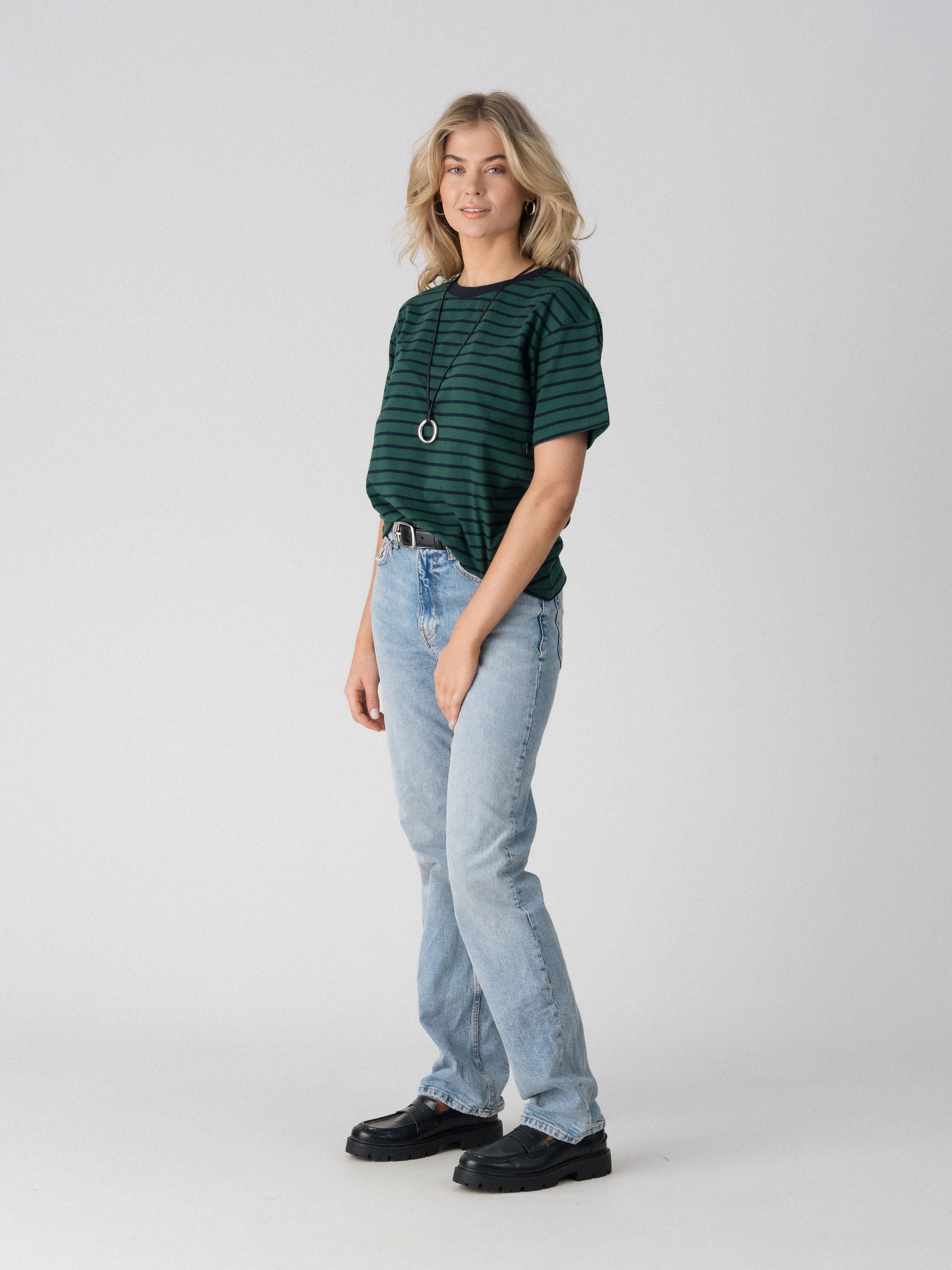 Lenelly Issa striped tee in forest green and navy, angled view showing the relaxed everyday fit