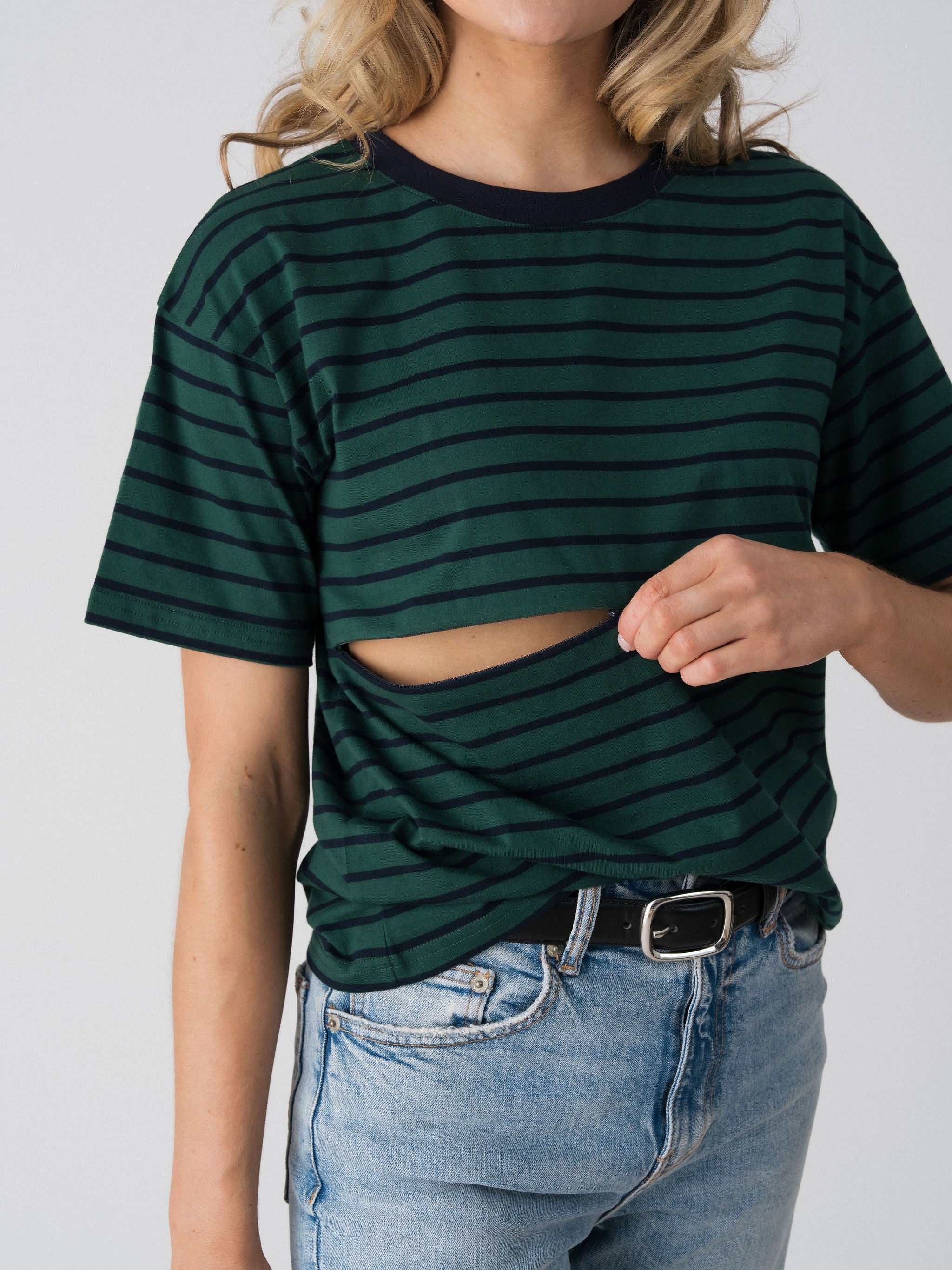 Lenelly Issa nursing tee in forest green and navy with the two-way underbust zip opened, showing how the breastfeeding access works