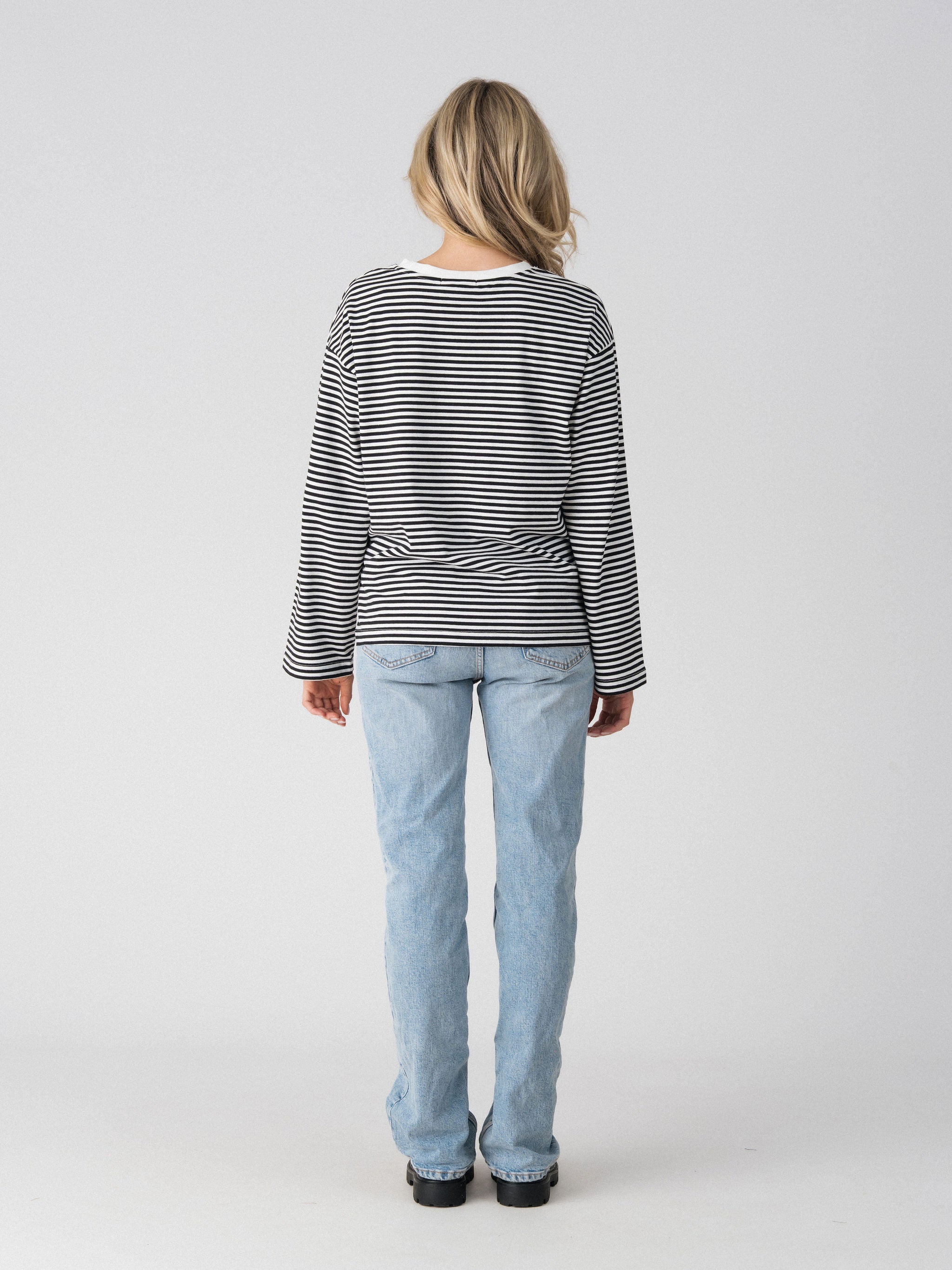 Back view of the Lenelly Lena oversized long sleeve striped tee in black and white