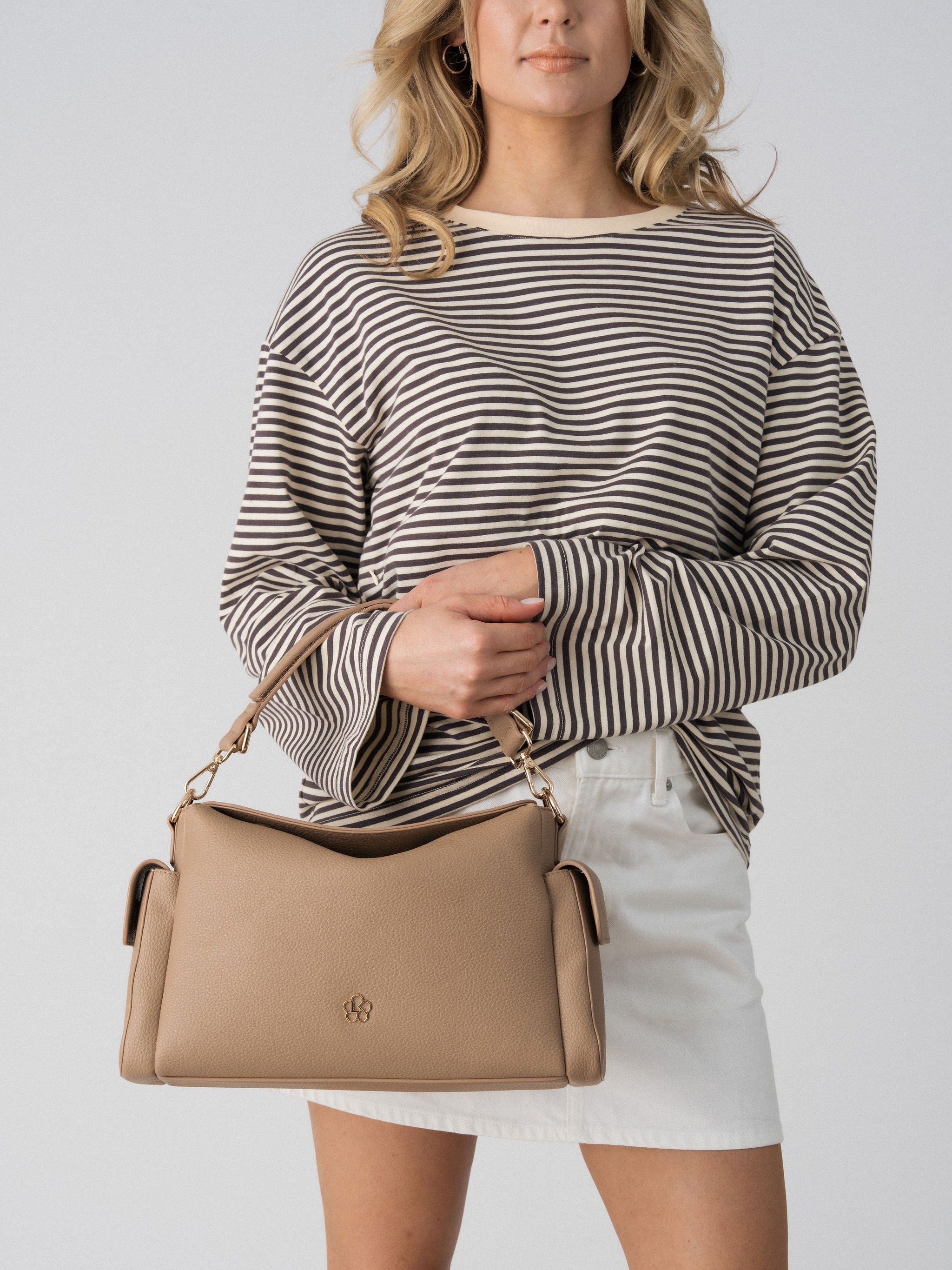 Close-up of the Lenelly Lena nursing tee in grey and off-white stripe with the Lenelly Hera pram caddy bag in latte
