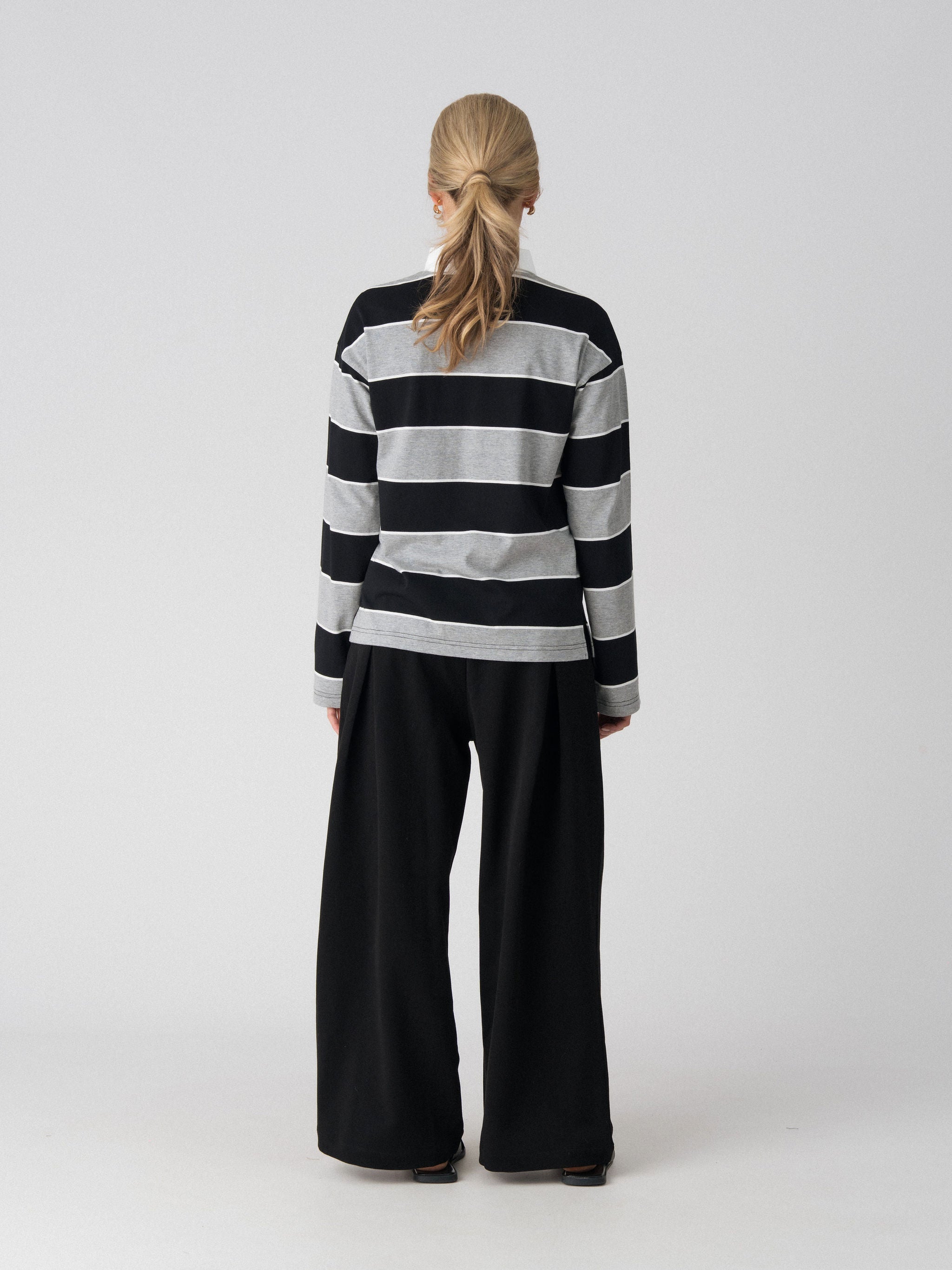 Back view of the Lenelly Erika rugby nursing polo in black and grey stripe