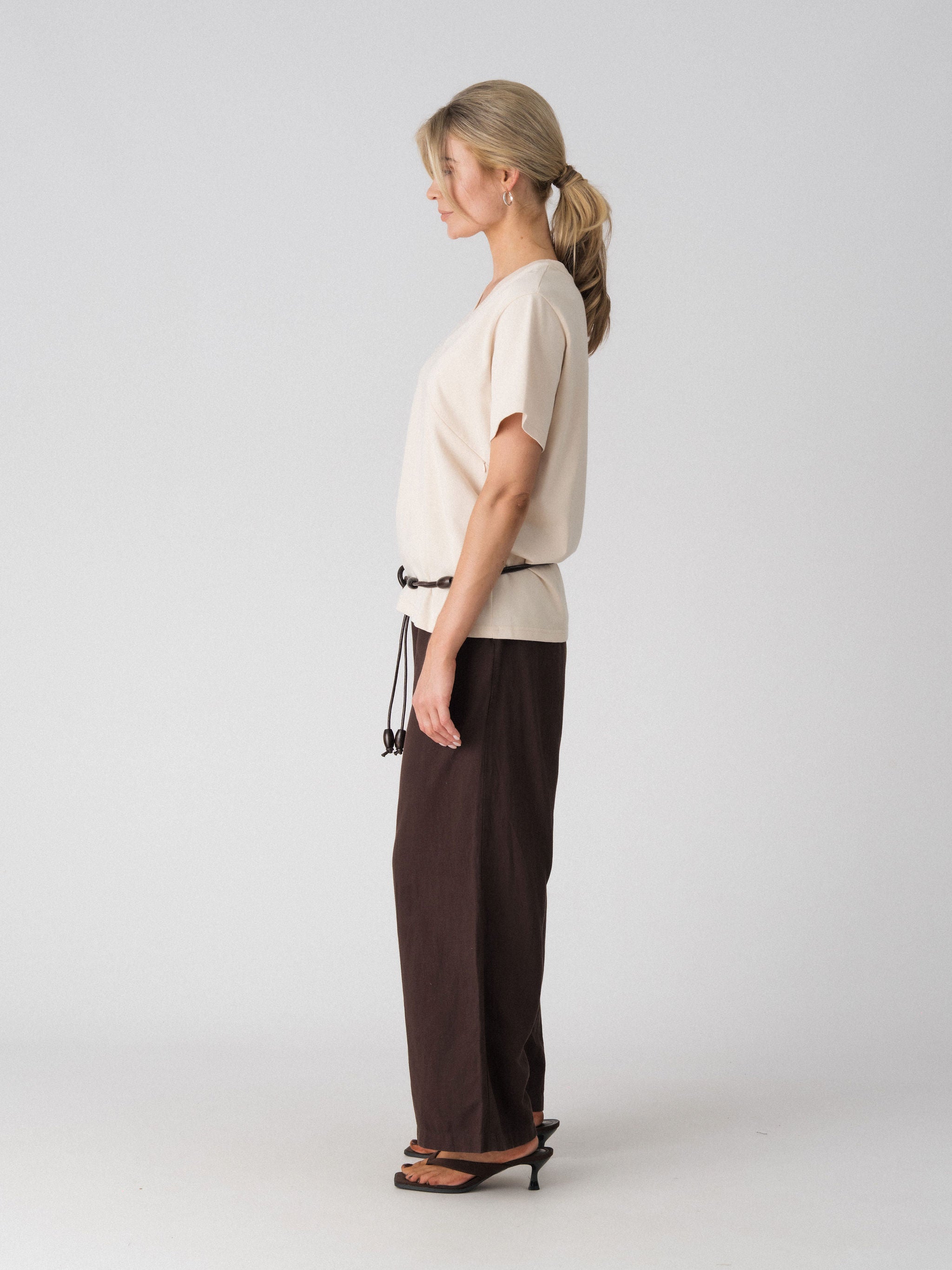 Lenelly Avery V-neck tee in sand, side view showing the relaxed oversized fit