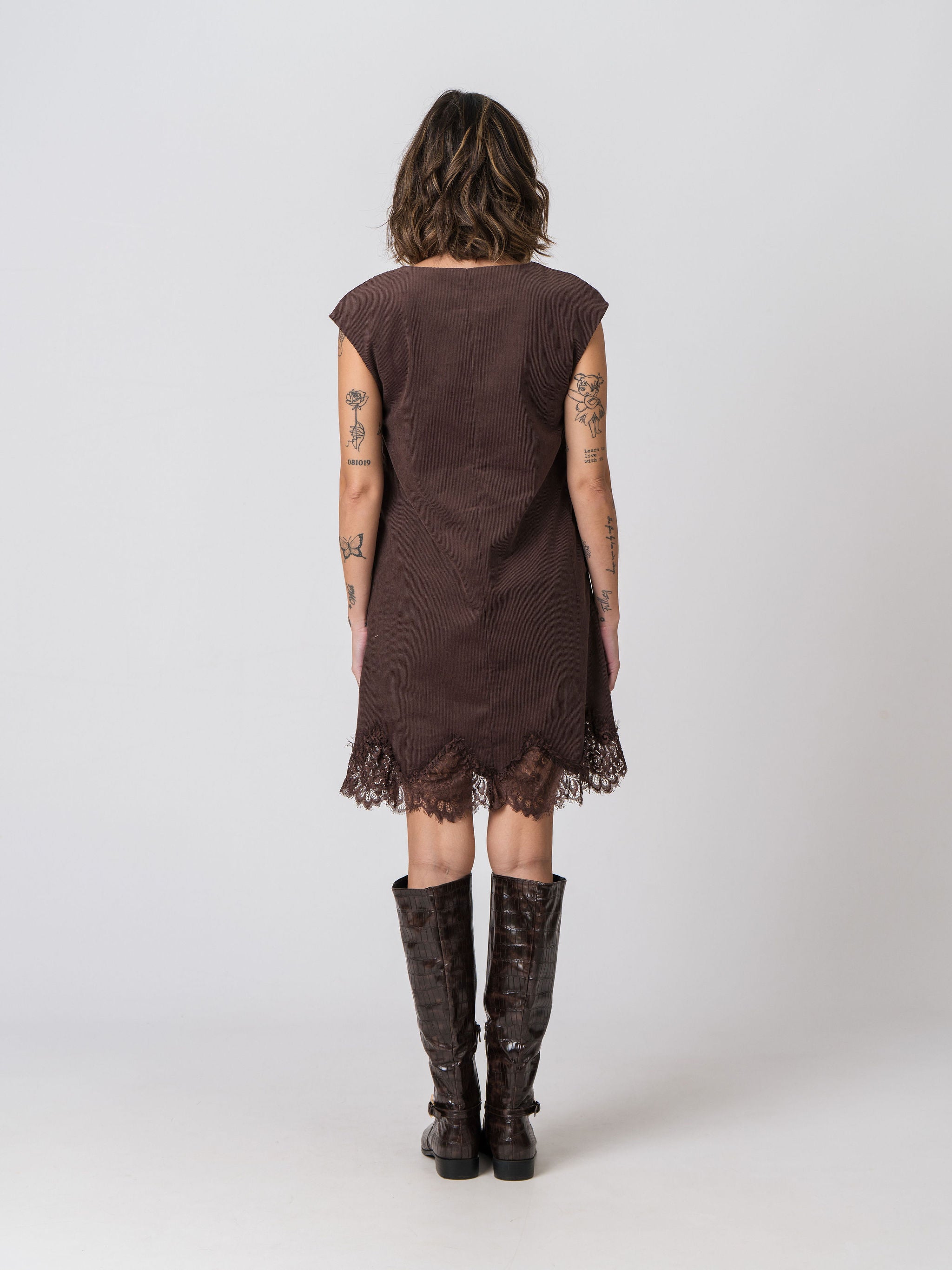 Back view of the Lenelly Audrey corduroy dress in chocolate brown with delicate lace trim hem