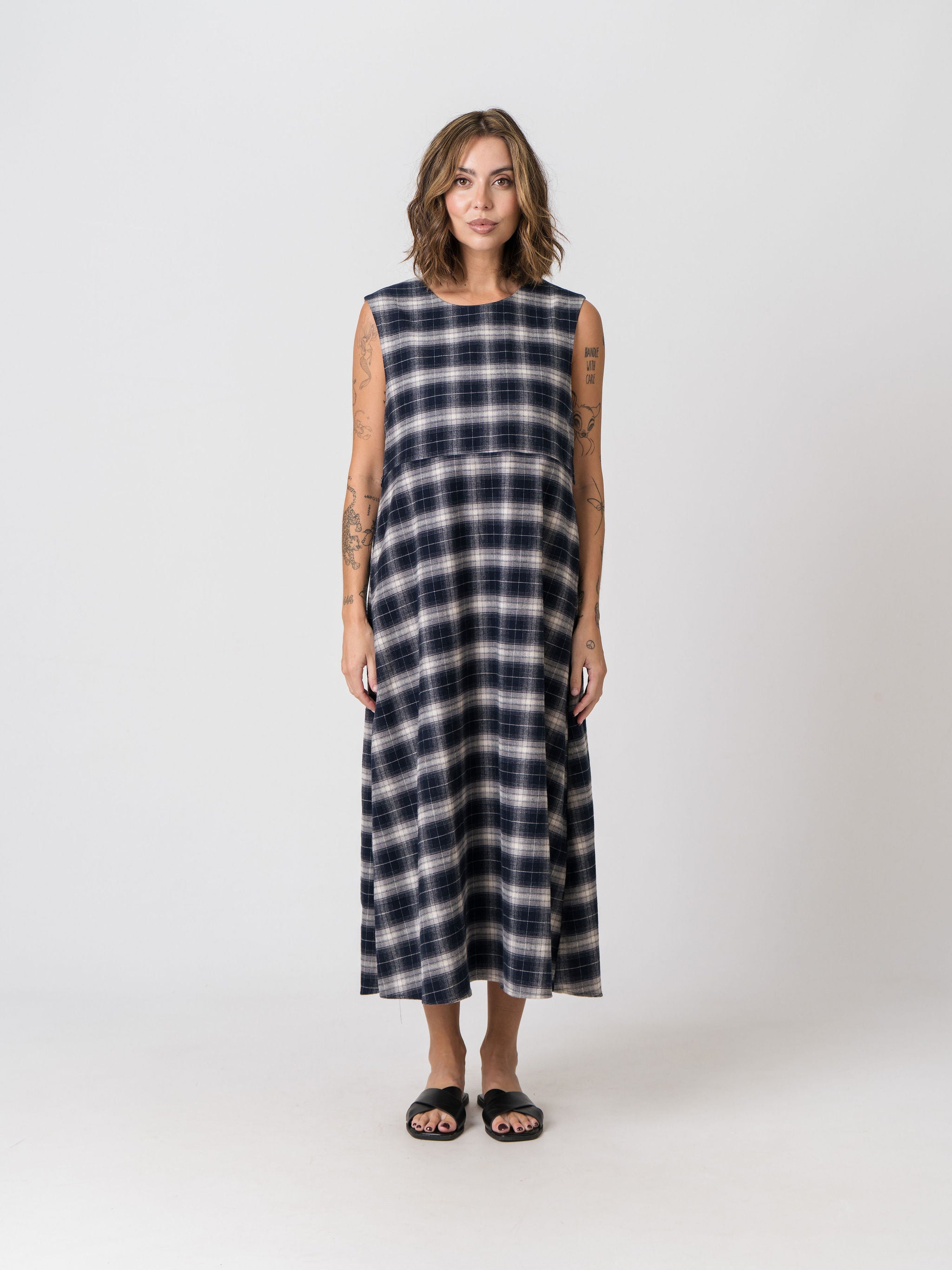 Lenelly Bridget reversible flannel dress in navy and cream plaid, a sleeveless breastfeeding-friendly midi dress, front view on a white background