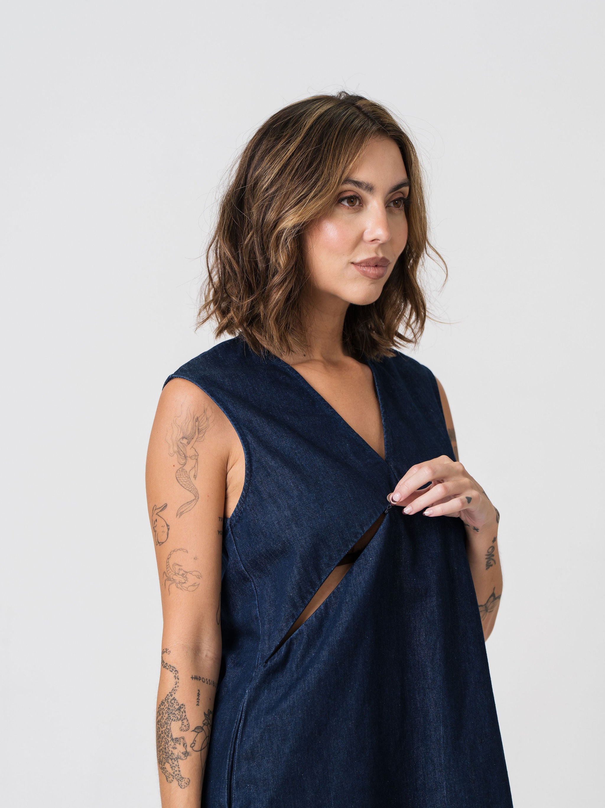 Close-up of the hidden nursing zip on the Lenelly Frankie denim dress, shown open for feeding access