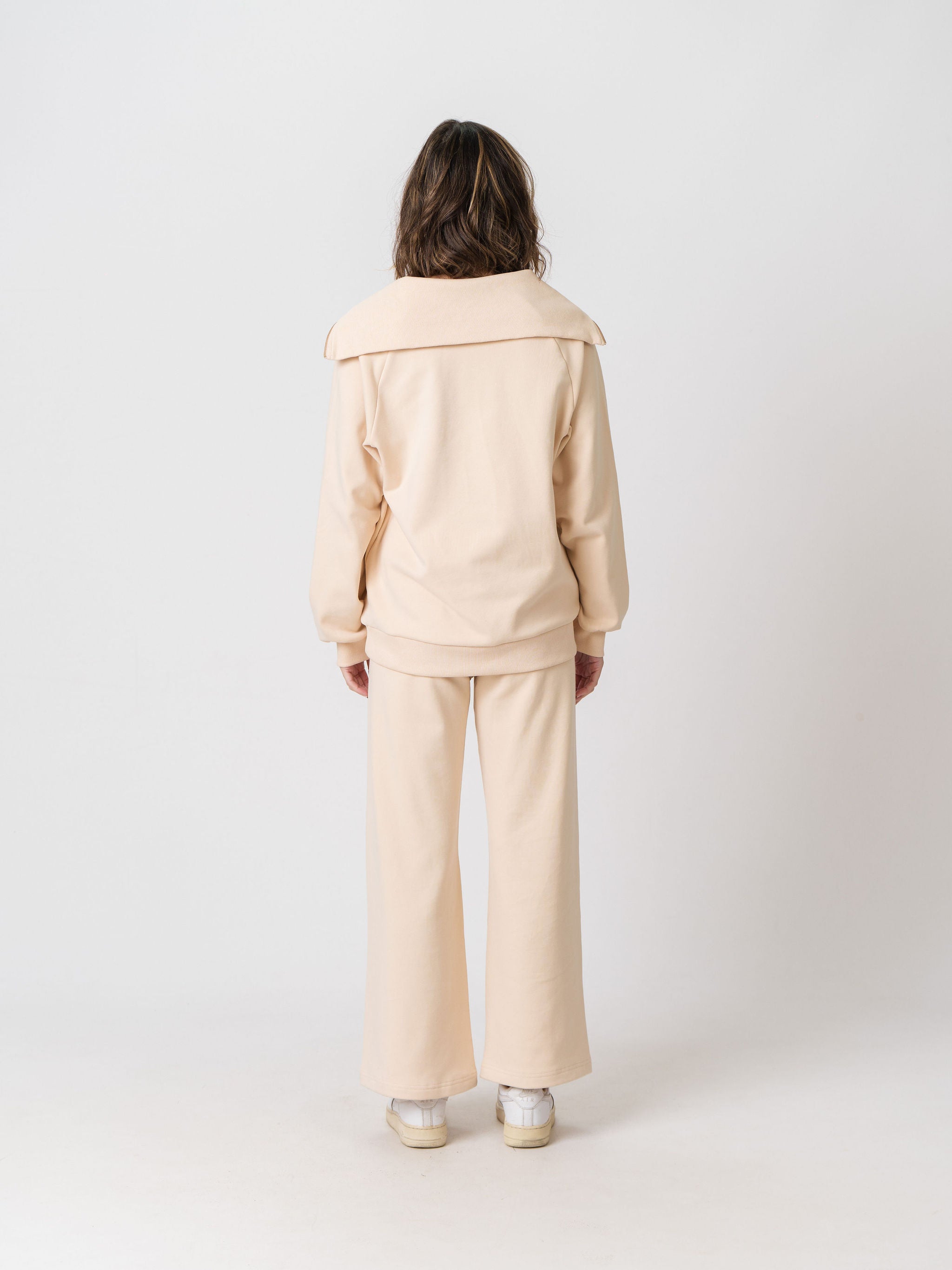 Back view of the Lenelly Mish half zip sweatshirt in apricot, showing the oversized fold-over collar